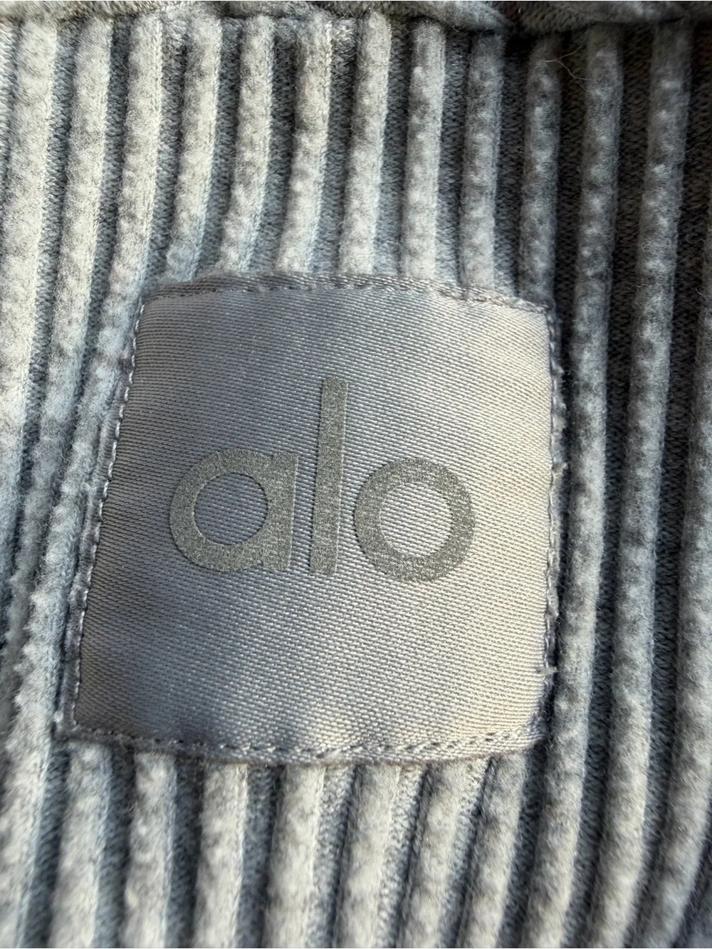 Alo Yoga Muse Hoodie in the color Athletic Heather Grey. Size large